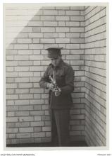 Evelyn Owen with an Owen Gun